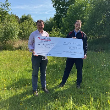 MP Guy Opperman with a grant cheque from Northern Powergrid Foundation for Hexham constituency