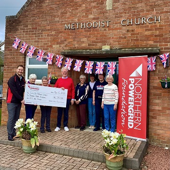 Scots Gap residents receiving a cheque from Northern Powergrid